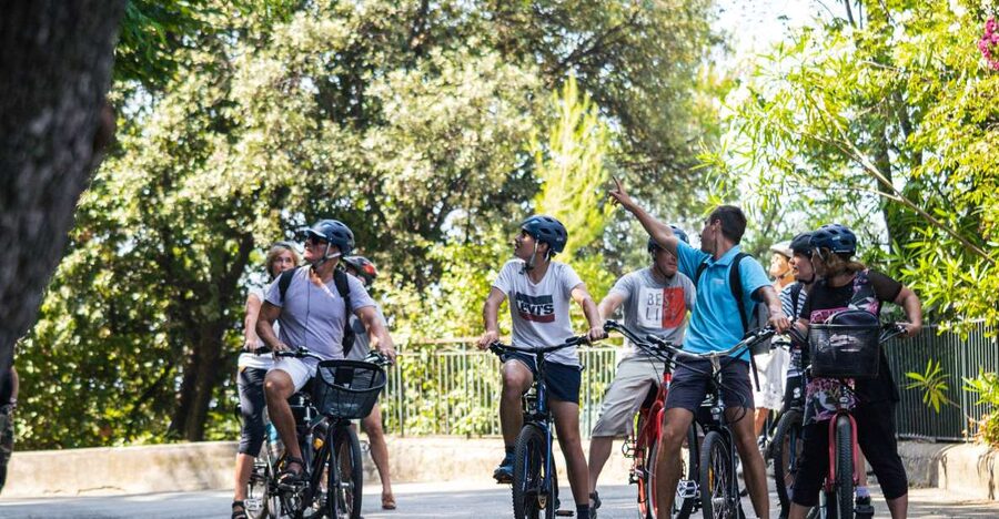 Nice: E-Bike City Highlights Tour - The Negresco, blue chairs, and seaside landmarks